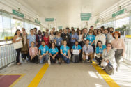 MOBILIZE participants take a group picture in a bus terminal. Bike parking and bike share options have been integrated with bus stations and terminals.