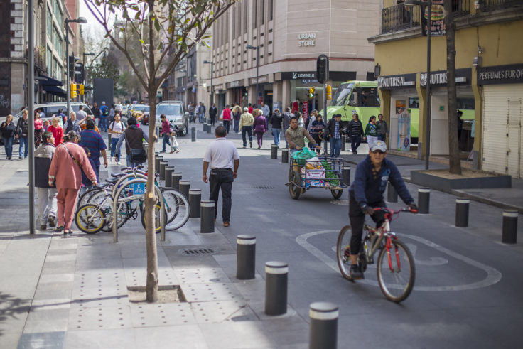Man on bicycle in pedestrian area