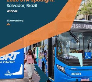Poster announcing 2026 STA Spotlight winner, Salvador, Brazil; shows a blue city bus at a Salvador bus stop with logos for Sustainable Transport Award and ITDP.