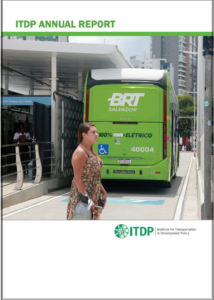 Cover image for ITDP Annual Report: a green BRT bus labeled 'Salvador' at a bus stop, with a woman in a floral dress walking in front; ITDP logo at bottom.