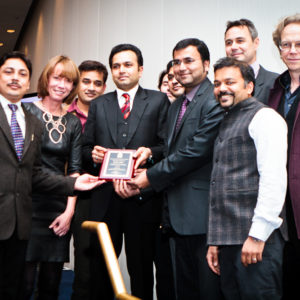 Representatives from iBus accept an Honorable Mention for Indore, India