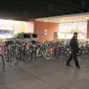 Covered bike parking at bus station with guard
