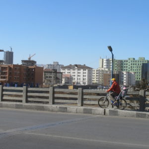Cyclist on UB bridge crossing in precariously narrow pedestrian path_UB_April2011_MK