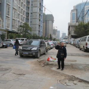 Broken walking environment and several lines of on-street parking_Kunming_March2011_MK