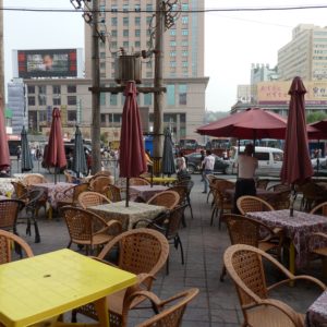 Outdoor Seating near two drinks vendors near bus terminal