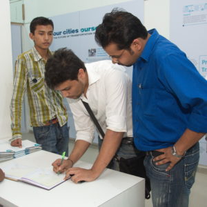 Visiotrs giving feedbacks at Vision of 10 global cities exhbition at KCA, Ahmedabad.